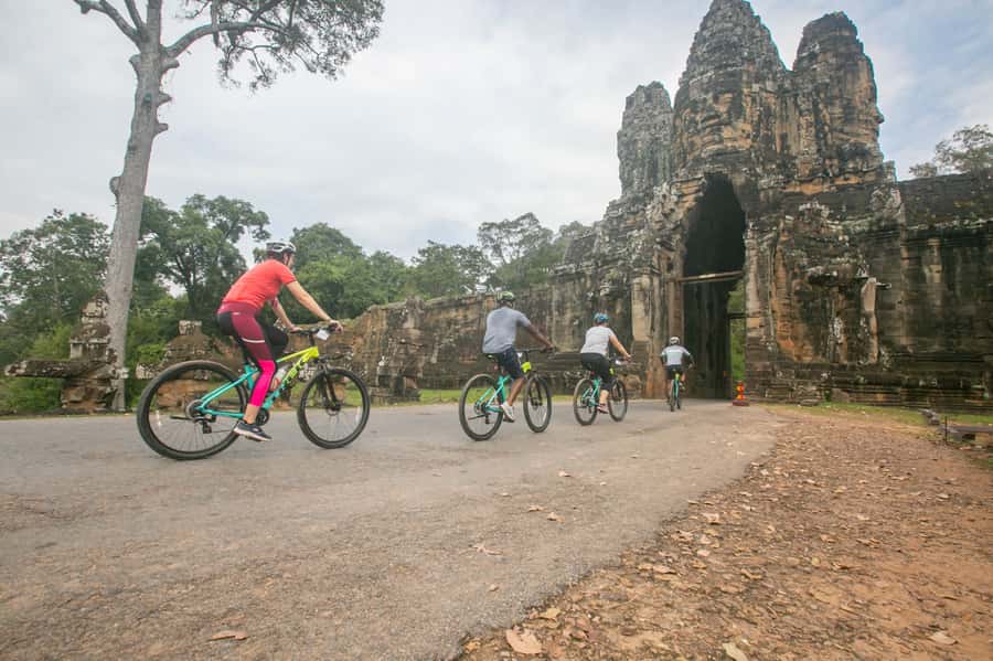 Angkor Wat: Guided Sunrise Bike Tour w/ Breakfast and Lunch - Bayon and Ta Prohm: Two Temples, Two Very Different Moods