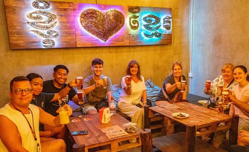 Phnom Penh: Night Foodie Tour by Tuk Tuk with Drinks - Hidden back-alley lort cha near the Royal Palace