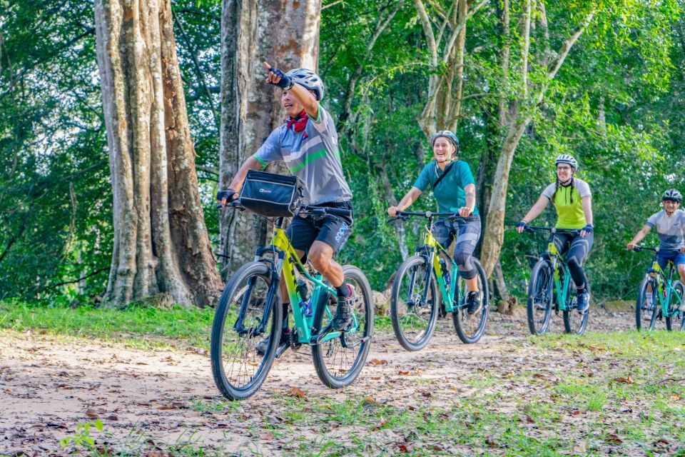 Siem Reap: Angkor Sunset Bike & Boat Tour /E-Bike Available - Cycling the quiet route: behind Angkor Wat and past the crowd line