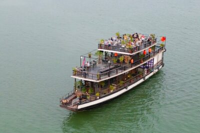 Sunset Cruise with unlimited beer & soft drinks -English speaking guide on board - Drinks, fruit platter, and the on-board comfort that matters